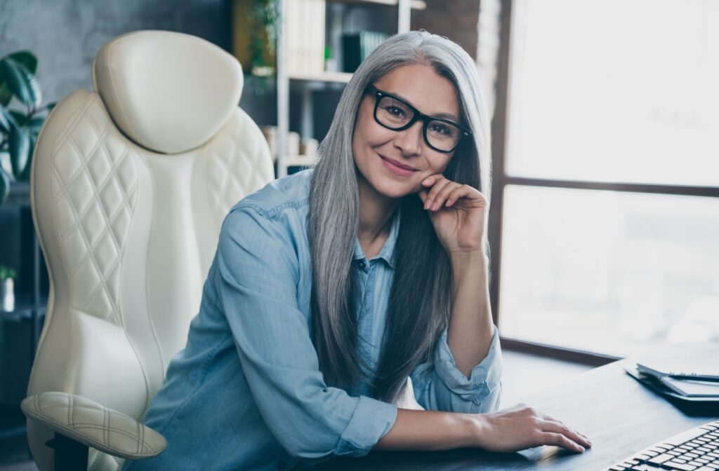 An older woman wearing a pair of smart-looking progressive lenses.