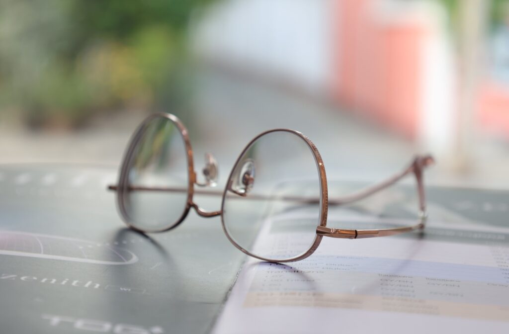 A pair of progressive lenses rest on a tabletop.